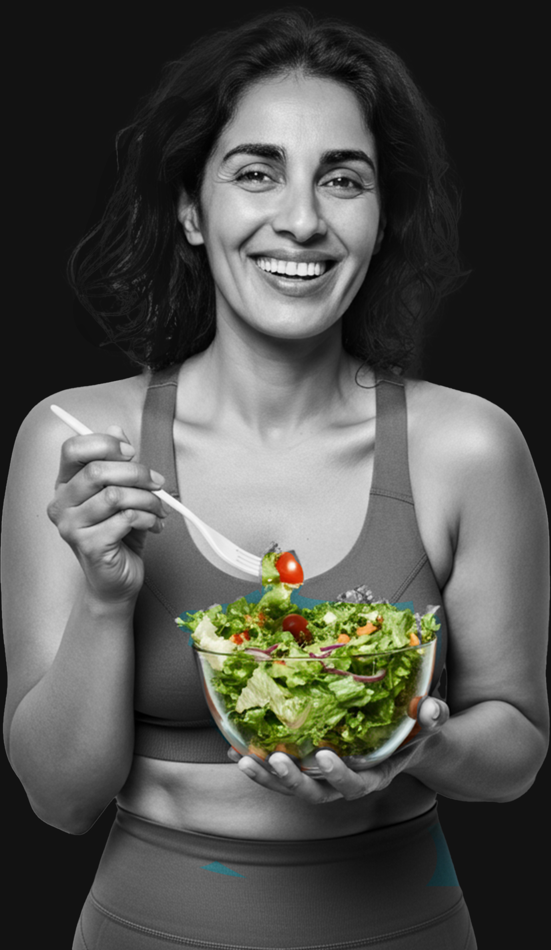 Smiling nutrition coach holding a fresh salad